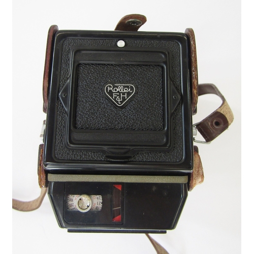 107 - Rollei Magic medium format TLR camera in black, serial no.2502858, in original leather outer casing ... 