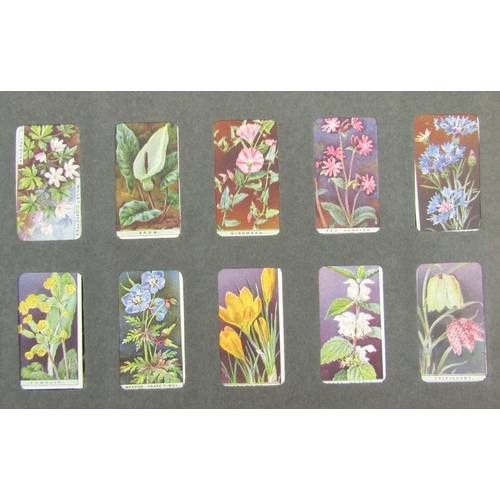 91 - Ephemera and other collectables to include an early 20th century scrap album, postcard album includi... 