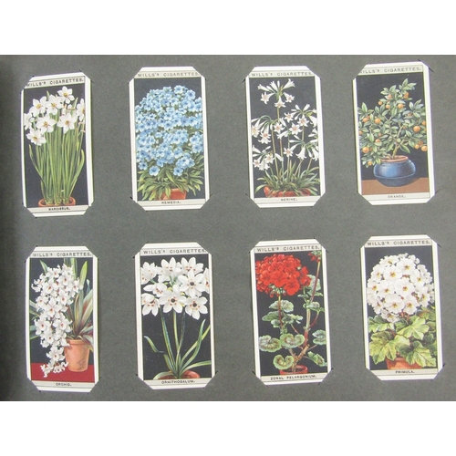 91 - Ephemera and other collectables to include an early 20th century scrap album, postcard album includi... 