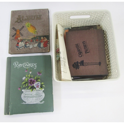 91 - Ephemera and other collectables to include an early 20th century scrap album, postcard album includi... 