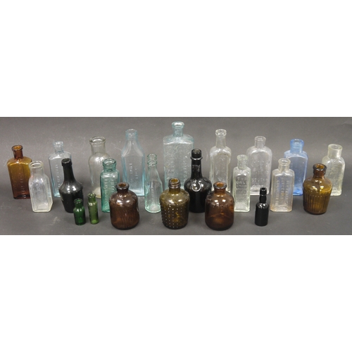 112 - A collection of early 20th century small apothecary bottles in blue, clear and brown tints, includin... 