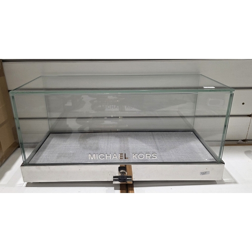 183 - Contemporary Michael Kors counter top shop display cabinet of rectangular form, comprising five glas... 