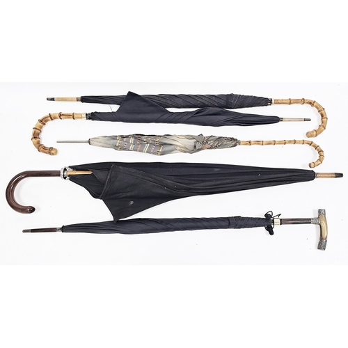 189 - Collection of five mid-20th century umbrellas, one with 9ct gold ferrule and curved bamboo handle, a... 
