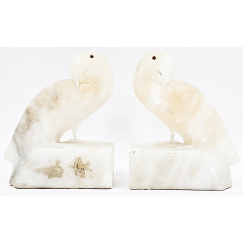 195 - Pair of Art Deco pink tinted alabaster bookends in the form of parakeets, 15cm high