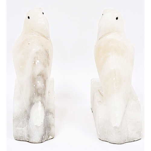 195 - Pair of Art Deco pink tinted alabaster bookends in the form of parakeets, 15cm high