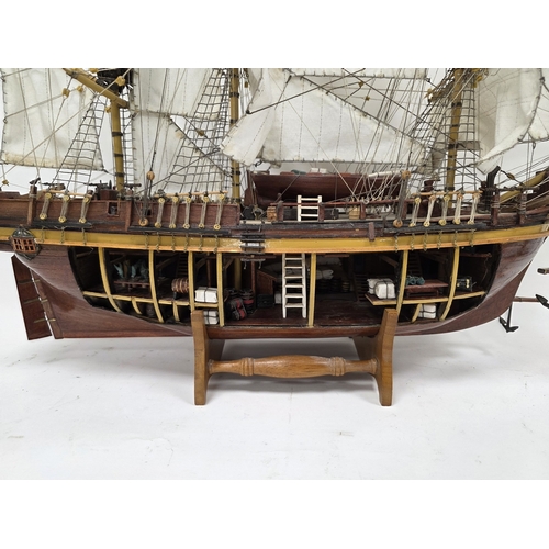 203 - Wooden kit-built model of HMS Bounty, one side of the hull open revealing the inner decks with barre... 