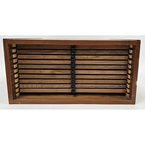 225 - Mid-century teak coin collector's cabinet, the lockable lift-off front opening to ten coin drawers w... 