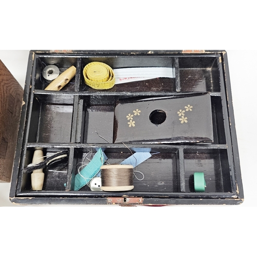 229 - Mauchlinware Newbiggin Beach moneybox in the form of a clock, 11cm high, an Art Deco oak table-top b... 