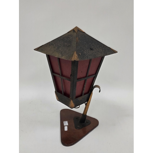 232 - Mid-century metal lantern table lamp with copper mounts and opaque textured red glass panels, on a t... 