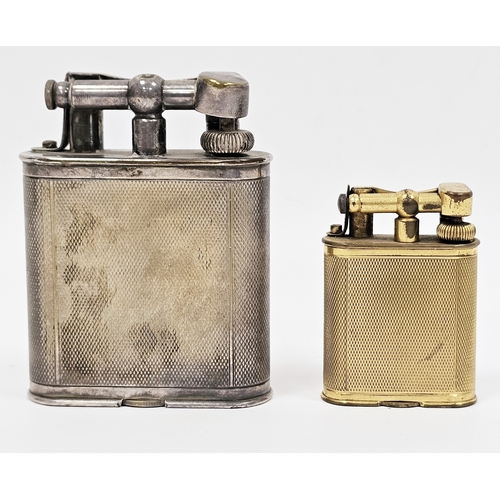 274 - Two 1920's Alfred Dunhill lift-arm table lighters, one in a silver plated case and the other in a gi... 
