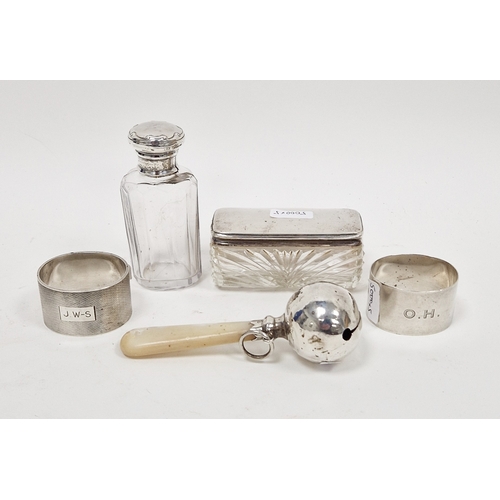281 - Edwardian silver-mounted cut-glass scent bottle a silver-mounted glass pin box, two napkin rings, a ... 