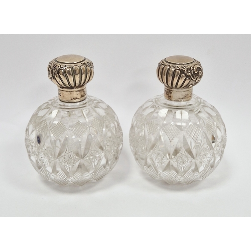 299 - Pair of late Victorian silver-mounted dressing table jars by Mappin & Webb, London 1899, the spheric... 