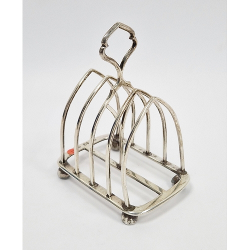 313 - Victorian silver four-division toastrack by Edward Gilbert, London 1882, of pointed arch design, 9cm... 