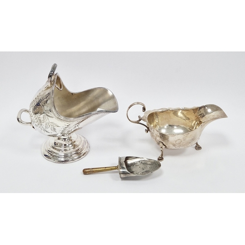 315 - Silver sauce boat by Asprey & Co Limited, London 1934, with wavy rim and scroll handle, on three hoo... 