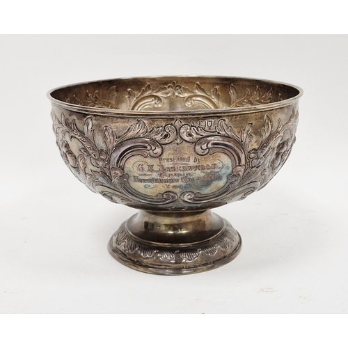 318 - Silver presentation bowl, London 1904, of circular form with scrolling floral decoration, on circula... 