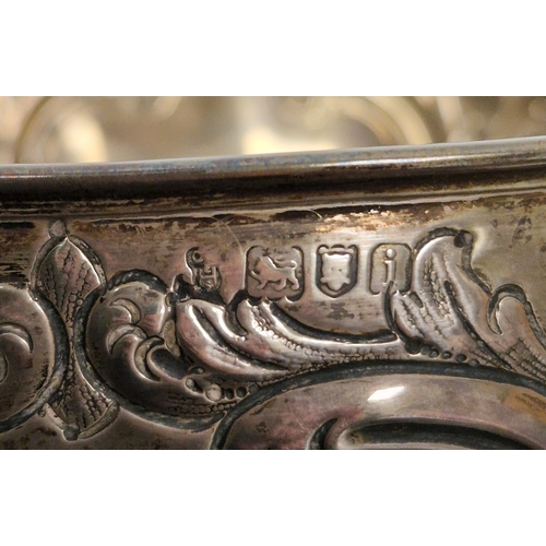 318 - Silver presentation bowl, London 1904, of circular form with scrolling floral decoration, on circula... 