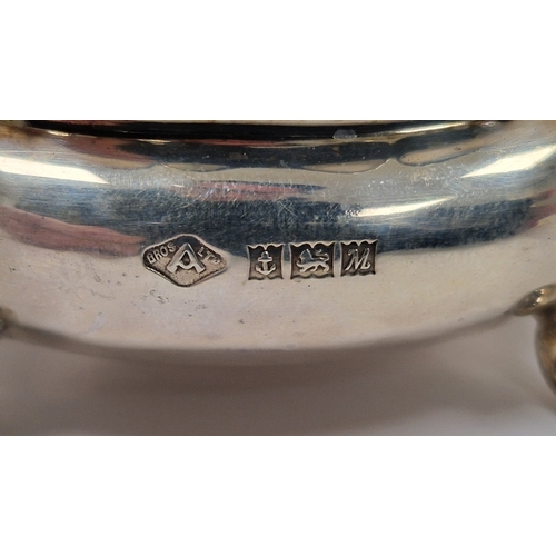 341 - Silver condiments, comprising: a salt, blue glass liner & spoon, a mustard pot, glass liner and spoo... 