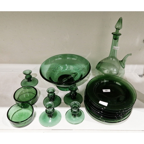 69 - Group of green tinted glassware including a footed bowl, a decanter and two stoppers, five candlesti... 