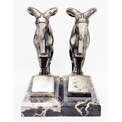 118 - After Max Le Verrier a pair of Art Deco-style bookends in the form of spelter mountain goats on marb... 