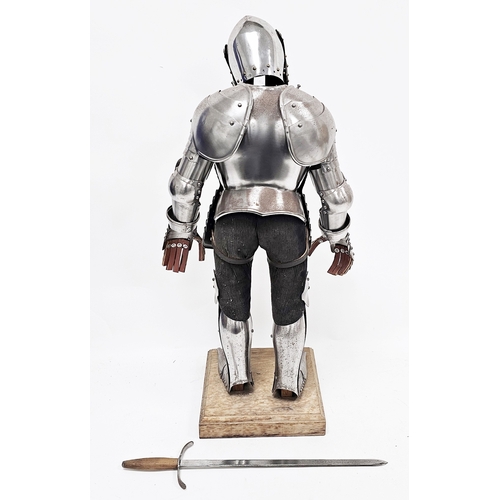 140 - Vintage miniature model of a 15th century Gothic style suit of armour, mounted on a fabric covered m... 