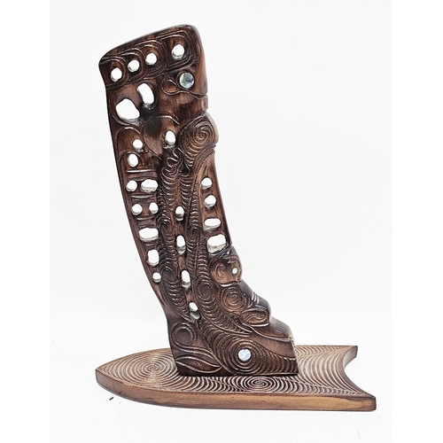 141 - Replica Maori Waka wooden stem or stern post, carved with figures having mother of pearl eyes, label... 