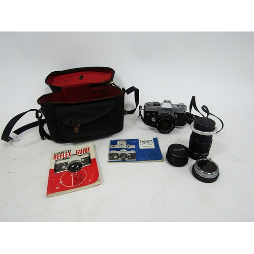 154 - Canon reflex FTQL camera, no. 125836 together with a Canon Hanimex tele-lens no.H67689, with two ins... 