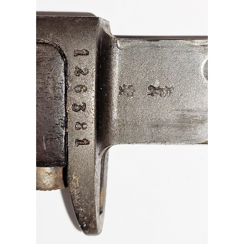 164 - Norwegian M1894 bayonet and scabbard with wooden grip and steel sheath, stamped 126381, the blade 8.... 