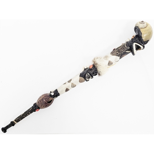 166 - Ethnographic ritual short staff constructed from natural materials including a large snailshell fini... 