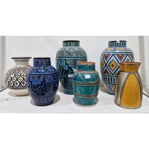 21 - Group of contemporary Moroccan pottery vases, painted with foliate bands, lozenges and lappet-shaped... 