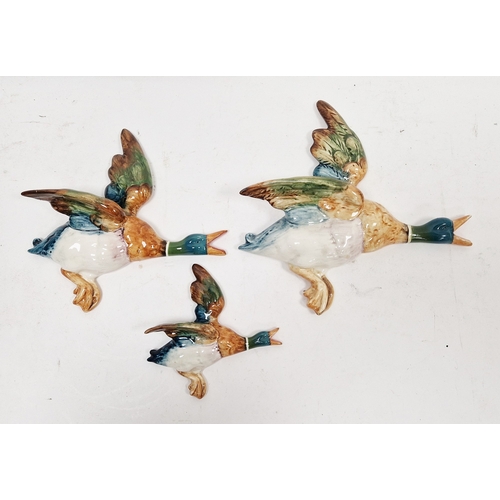 27 - Set of three Beswick pottery duck wall plaques in sizes, printed and impressed marks (damages and re... 