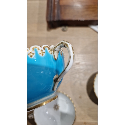 29 - English porcelain turquoise ground composite part tea and dessert service in the Minton style, impre... 