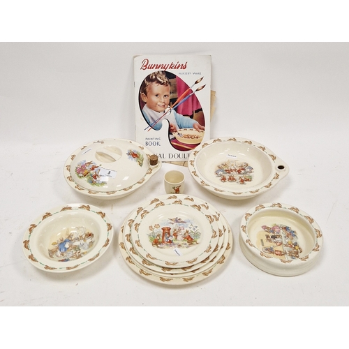 5 - Royal Doulton Bunnykins pattern nursery wares, printed marks, comprising: an egg cup, two warming di... 