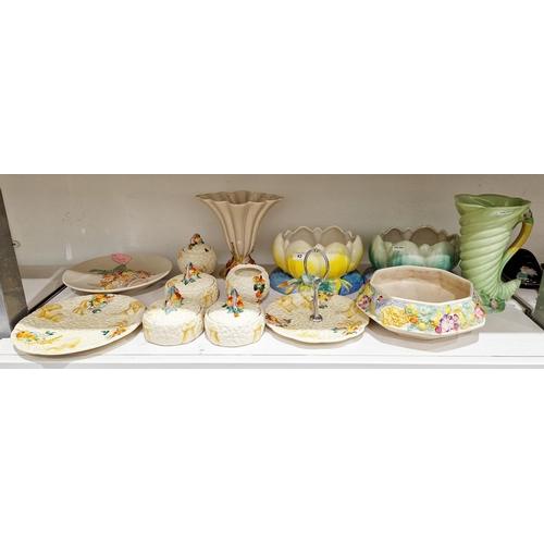 42 - Group of Clarice Cliff Newport Pottery Celtic Harvest pattern wares including: a cake dish, five sug... 