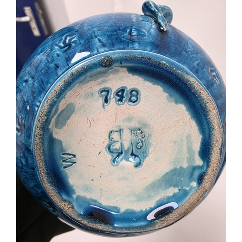 86 - Pair of Burmantofts turquoise ground dragon moulded double-gourd shaped jugs, late 19th century, imp... 