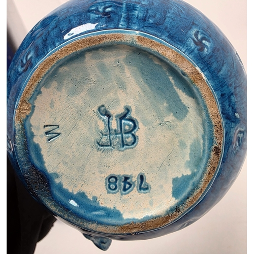 86 - Pair of Burmantofts turquoise ground dragon moulded double-gourd shaped jugs, late 19th century, imp... 