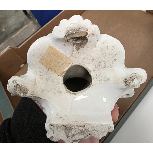 88 - Derby porcelain putto candlestick figure, circa 1775, with flowering bocage on pierced puce gilt roc... 