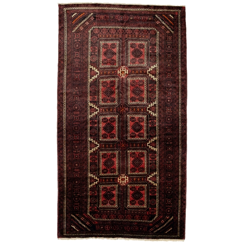 133 - A vintage Baluch carpet,  321cm x 176cm... 