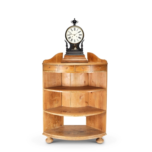 254 - A 1920's American Waterbury clock on a standing pine bowed corner shelves The 12