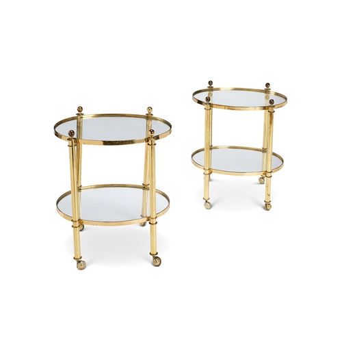 257 - A pair of 1970's lacquered brass two-tier etageres Each with two oval tiers, with turned finials and... 