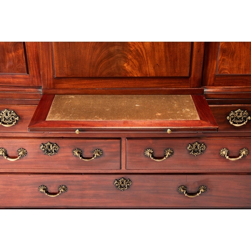 74 - A George III mahogany estate cabinet The cavetto moulded broken arch pediment above a central panell... 