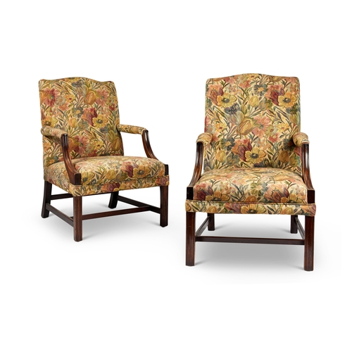 75 - A pair of late 19th century George III style mahogany Gainsborough chairs Upholstered in floral fabr... 