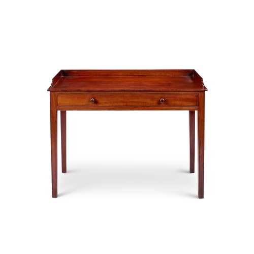 230 - A late Regency mahogany dressing table The rectangular top with three-quarter gallery above a frieze... 