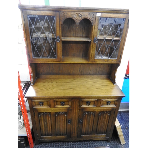 1401 - Oak dresser with two drawers over cupboard and linen fold design to doors - 45x 18x 70