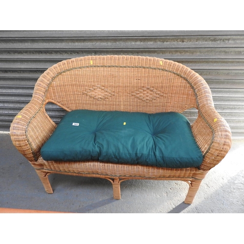 385 - Small wicker conservatory sofa with cushion