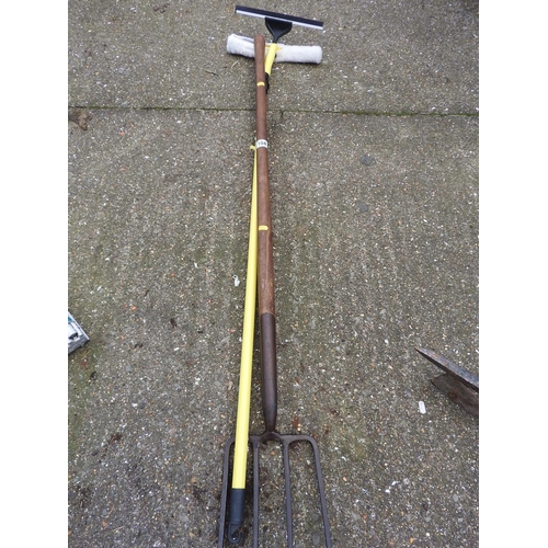 104 - Garden fork and a long handled squeegee