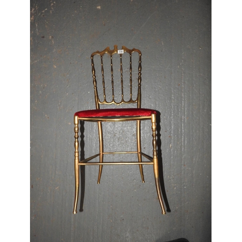 338 - Unusual brass chair with red upholstered seat