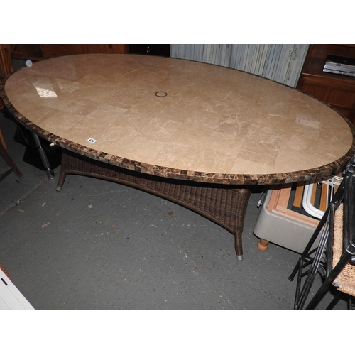 426 - Good quality marble topped oval garden/conservatory table with rattan base