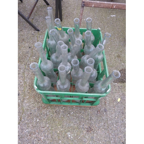 48 - Crate of unusual shaped glass bottles