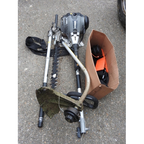 223 - Titan petrol strimmer with attachments