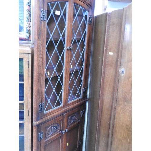 335 - Oak Old Charm style corner cupboard with leaded glass